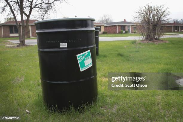 Drums labeled "non-hazardous waste" sits in the lawn at the West Calumet Housing Complex on April 19, 2017 in East Chicago, Indiana. Nearly all the...