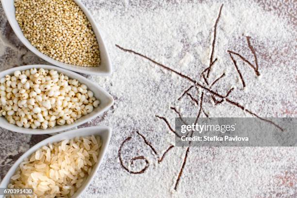 directly above shot of gluten free ingredients and the text gluten - chopping block flour stock pictures, royalty-free photos & images