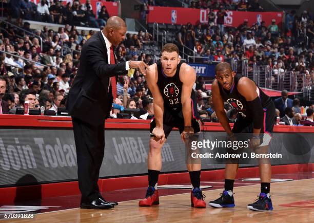 Chris Paul, Blake Griffin, and Head Coach Doc Rivers of the LA Clippers stand on the court during a game against the Cleveland Cavaliers on March 18,...