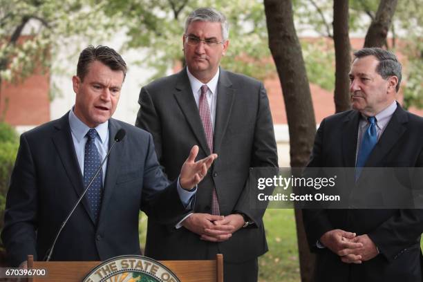 Senator Todd Young , Indiana Gov. Eric Holcomb and U.S. Senator Joe Donnelly address the media after meeting with former residents and taking a brief...