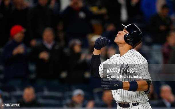 Aaron Judge of the New York Yankees gestures after he hit a home run in the fifth inning against the Chicago White Sox during a game at Yankee...