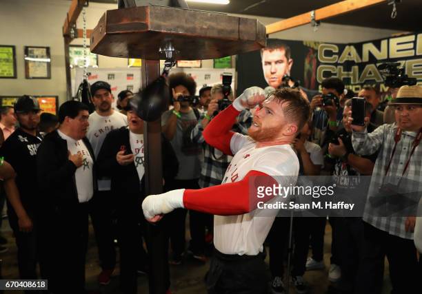 Boxer Canelo Alvarez of Mexico hits a speed bag in the ring during his Open Workout at the House of Boxing on April 19, 2017 in National City,...