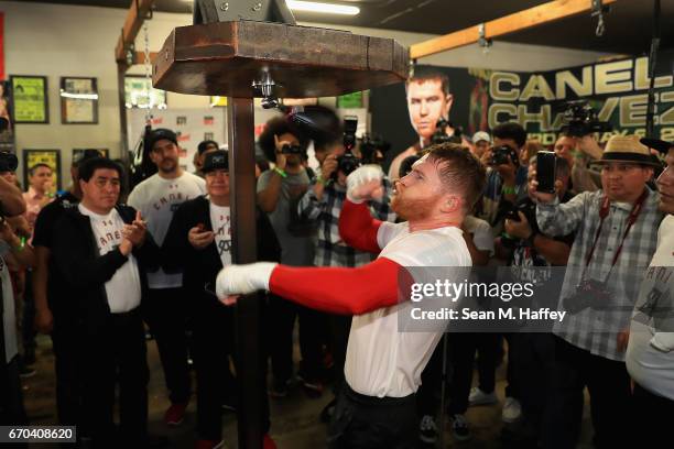 Boxer Canelo Alvarez of Mexico hits a speed bag in the ring during his Open Workout at the House of Boxing on April 19, 2017 in National City,...