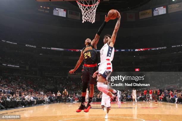 Kent Bazemore of the Atlanta Hawks blocks the shot Kelly Oubre Jr. #12 of the Washington Wizards during Game Two of the Eastern Conference...