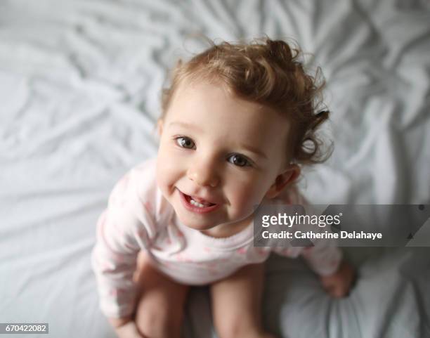 portrait of a 1 year old baby girl - baby girls stock pictures, royalty-free photos & images