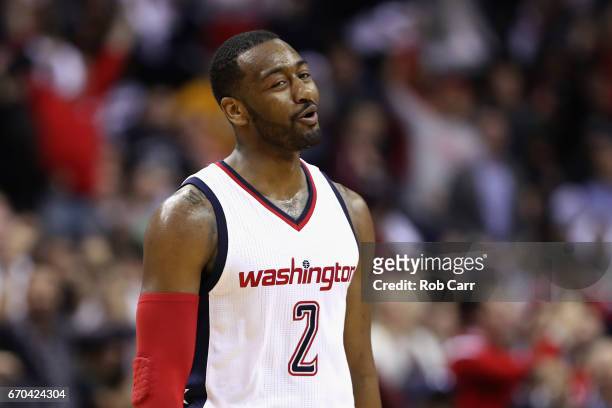 John Wall of the Washington Wizards reacts after making a shot in the second half of the Wizards 109-101 win over the Atlanta Hawks in Game Two of...