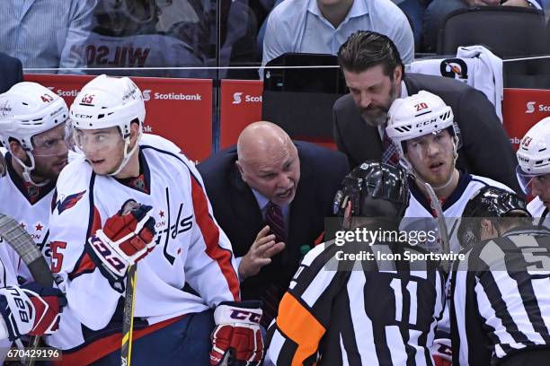 Washington Capitals Head Coach Barry Trotz debates a call with Referee Kelly Sutherland during to the Round 1 Game 4 of the NHL Stanley Cup Playoffs...