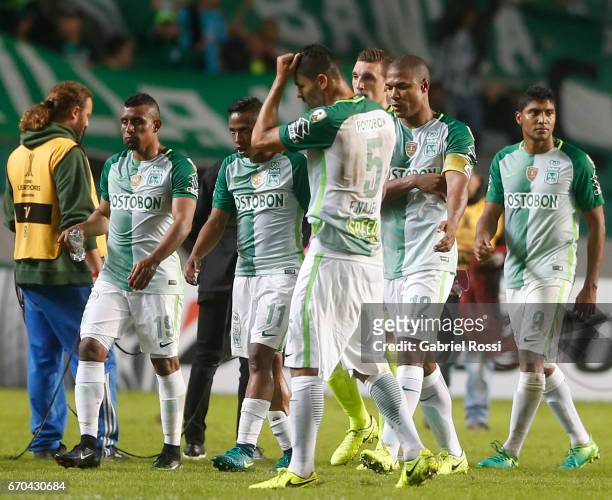 Players of Atletico Nacional leave the pitch disappointed during the group stage match between Estudiantes and Atletico Nacional as part of Copa...