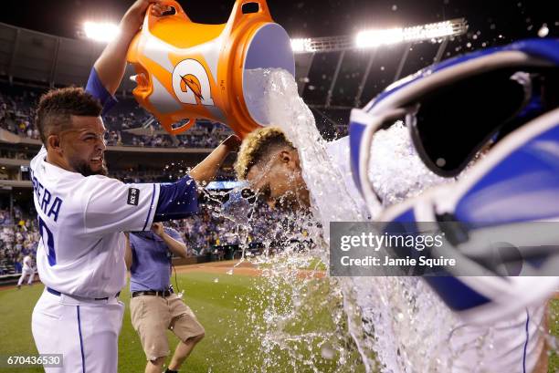 Relief pitcher Kelvin Herrera of the Kansas City Royals douses game MVP catcher Salvador Perez after the Royals defeated the San Francisco Giants 2-0...