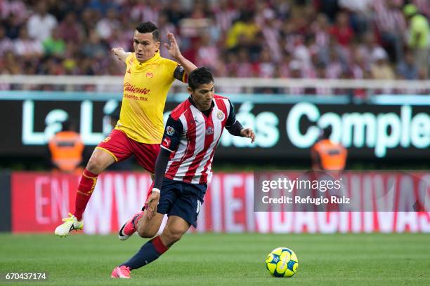 Angel Saldívar of Chivas fights for the ball with Juan Rodriguez of Morelia during the Final match between Chivas and Morelia as part of the Copa MX...