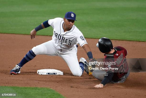 Yangervis Solarte of the San Diego Padres tags out Brandon Drury of the Arizona Diamondbacks as he tries to steal second base during the second...