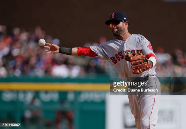 Second baseman Dustin Pedroia of the Boston Red Sox throws out Tyler Collins of the Detroit Tigers at first base on a grounder at Comerica Park on...