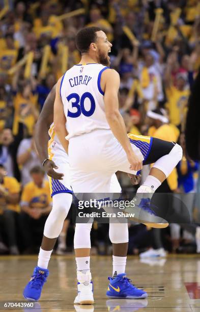 Stephen Curry of the Golden State Warriors reacts after making a three-point basket during their game against the Portland Trail Blazers in Game Two...
