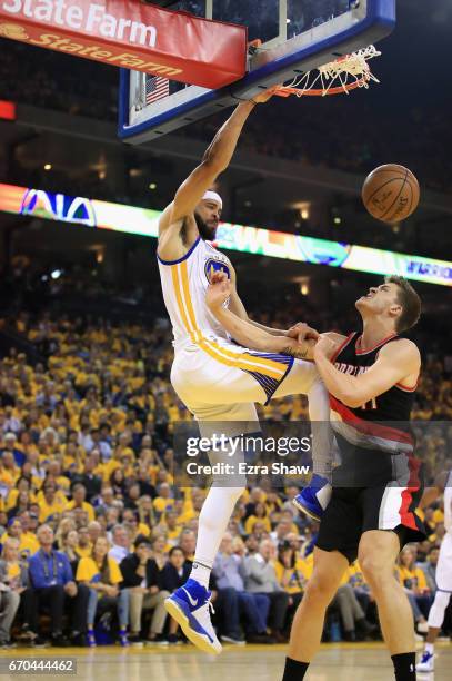 JaVale McGee of the Golden State Warriors dunks on Meyers Leonard of the Portland Trail Blazers in Game Two of the Western Conference Quarterfinals...