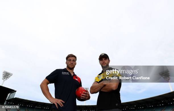 Jack Viney of the Melbourne Demons and Trent Cotchin of the Richmond Tigers pose during a Richmond Tigers AFL media session at ME Bank Centre on...