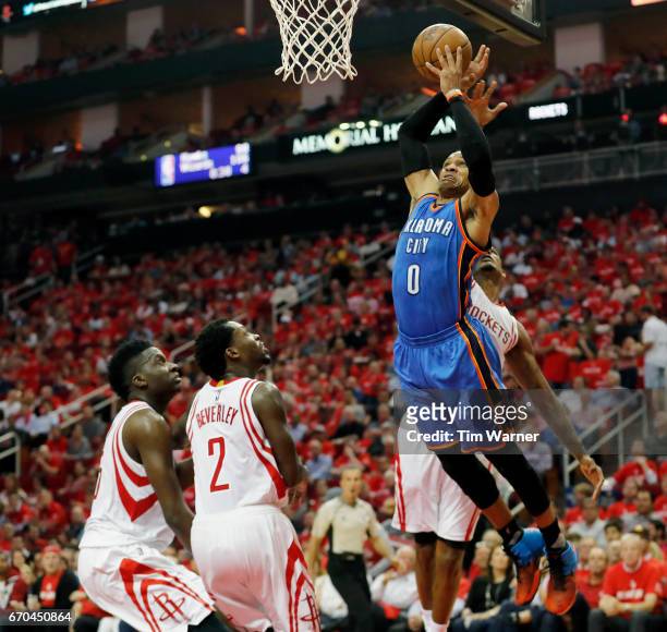 Russell Westbrook of the Oklahoma City Thunder goes up for a dund defended by Trevor Ariza of the Houston Rockets in the second half of Game Two of...