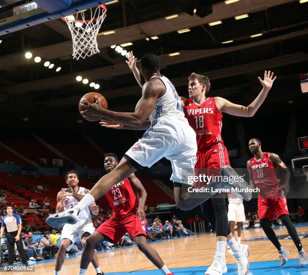 Reggie Williams of the Oklahoma City Blue drives against Kyle Wiltjer and Chinanu Onuaku of the Rio Grande Valley Vipers during Game 3 of the Western...