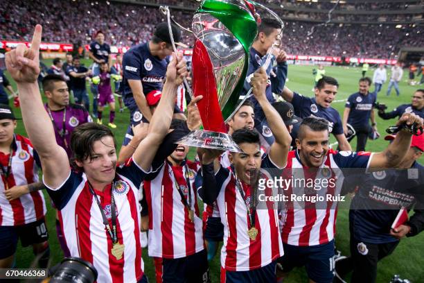 Players of Chivas lift the trophy to celebrate after winning the final match between Chivas and Morelia as part of the Copa MX Clausura 2017 at...