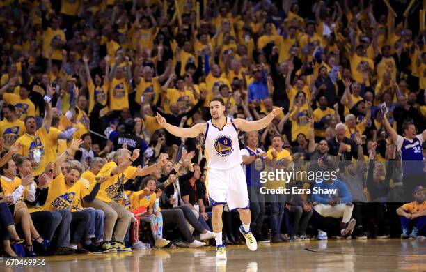Klay Thompson of the Golden State Warriors reacts after making a three-point basket during their game against the Portland Trail Blazers in Game Two...