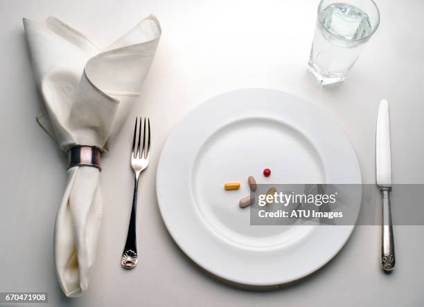 pills, plate - napkin stock pictures, royalty-free photos & images