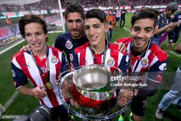 Carlos Fierro, Angel Zaldivar, Alan Pulido and Rodolfo Pizarro of Chivas celebrate with the trophy after winnig the final match between Chivas and...