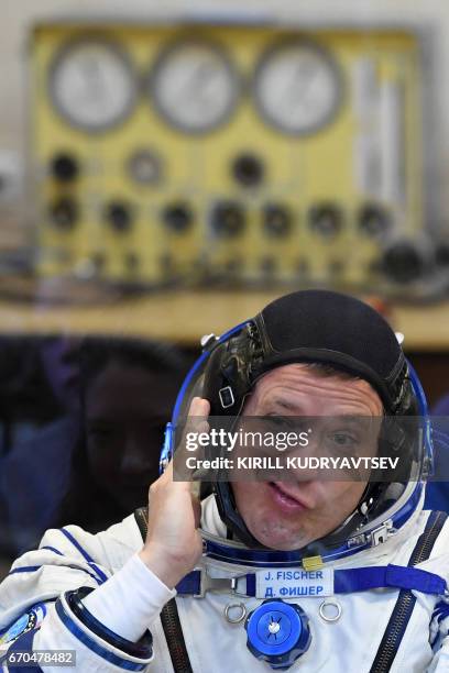 Astronaut Jack David Fischer, a member of the main crew of the 51/52 expedition to the International Space Station , reacts as his space suit is...