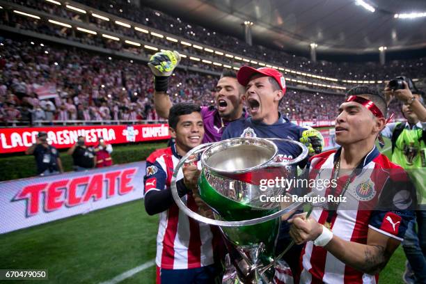 Orbelin Pineda, Angel Zaldivar, Miguel Jimenez and Michelle Benitez of Chivas celebrate with the trophy after winning the final match between Chivas...