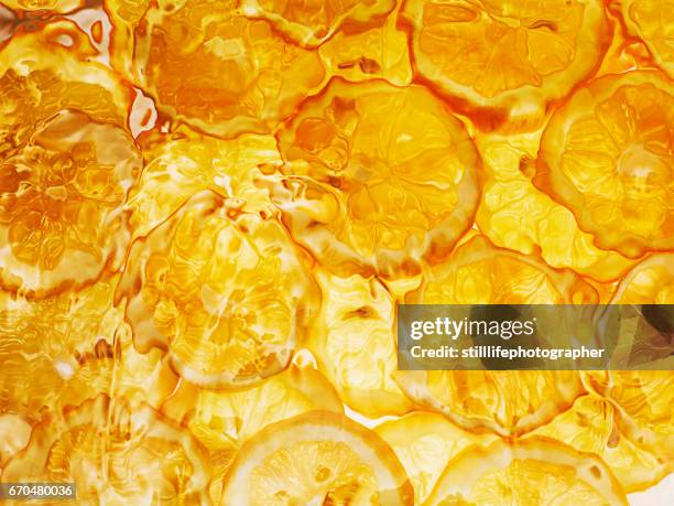 orange slices under water - refreshing stock pictures, royalty-free photos & images