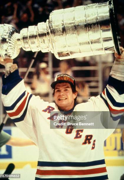 Goalie Mike Richter of the New York Rangers skates on the ice with the Stanley Cup Trophy after the Rangers defeated the Vancouver Canucks in Game 7...