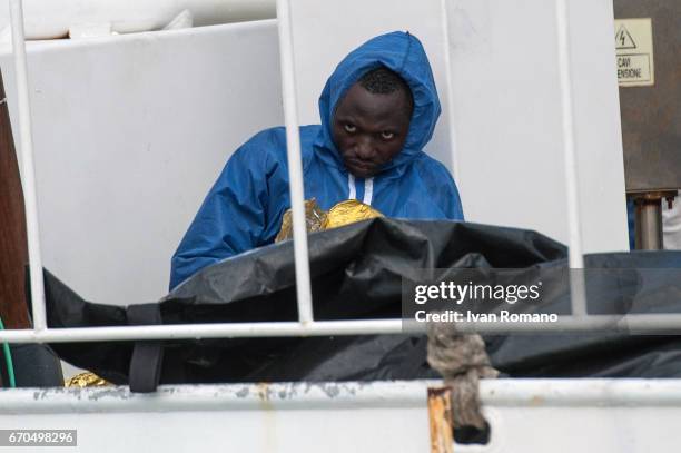 More than 400 migrants rescued in the Sicily Channel from the Italian Coast Guard ship the Gregoretti, take a rest on board the ship on April 19,...