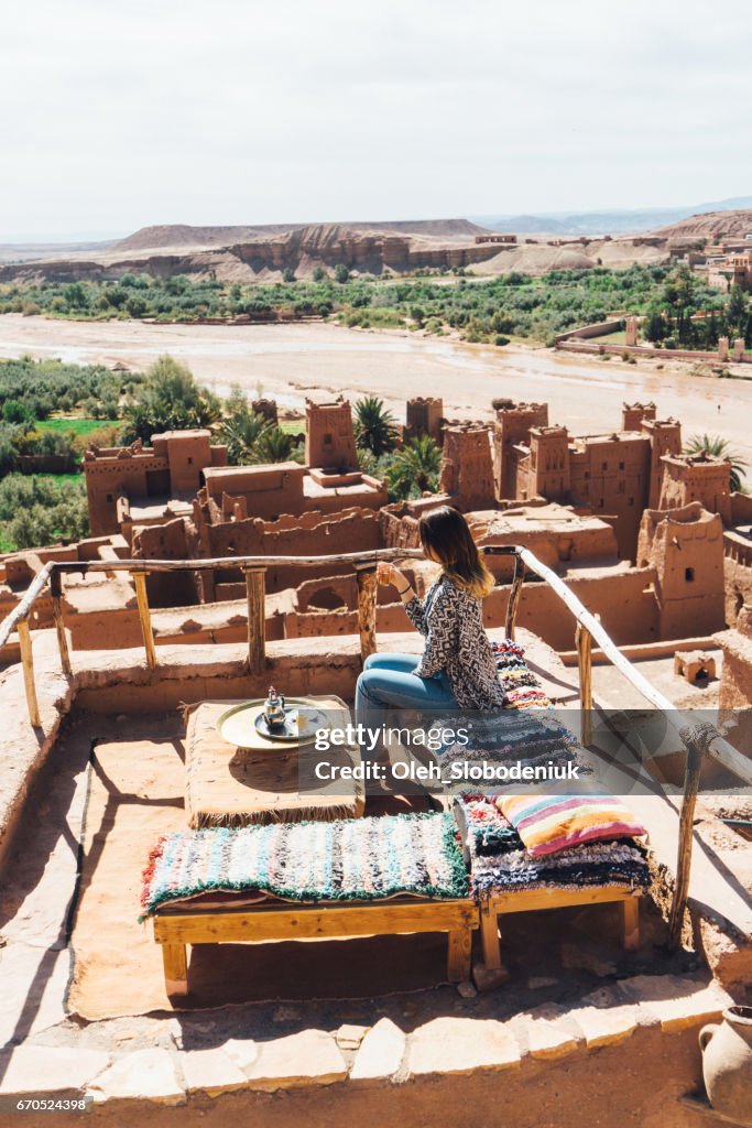 Woman drinking tea in Ait Ben Haddou Casbah