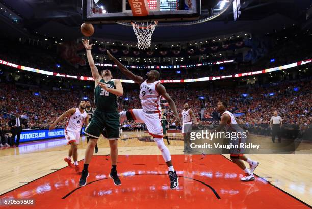 Mirza Teletovic of the Milwaukee Bucks shoots the ball as Serge Ibaka of the Toronto Raptors defends in the second half of Game Two of the Eastern...