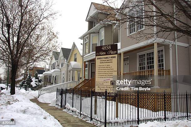 Realtor's sign is posted January 9, 2001 in front of a newly rehabed single-family home in the Ravenswood neighborhood of Chicago. Days earlier the...