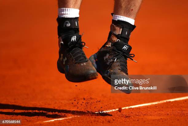 Detailes view of trainers kicking up the clay during the third round match between Andy Murray of Great Britain and Albert Ramos-Vinolas of Spain on...