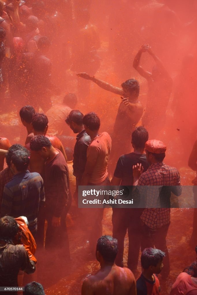 People celebrating Holi festival in Baldeo town, near Mathura, India.
