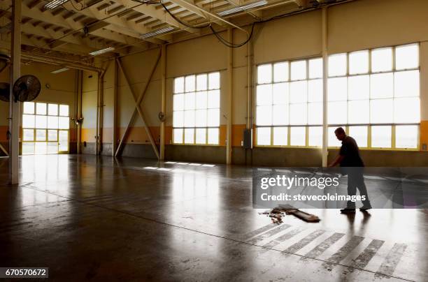 wearhouse cleaning - sweeping floor stock pictures, royalty-free photos & images