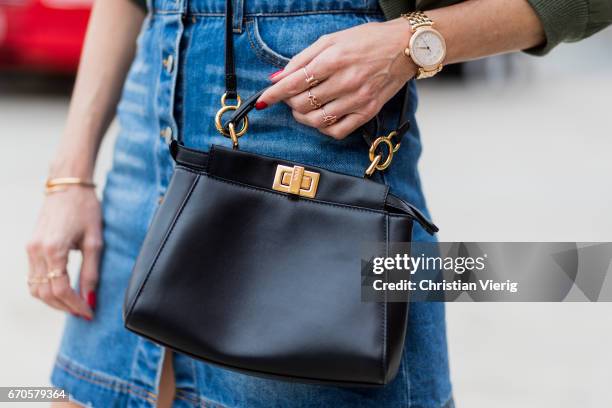 Model and fashion blogger Alexandra Lapp wearing a T-Shirt from ECNTRC with a Karl Lagerfeld look-a-like of Eddie the Head monster of the band Iron...