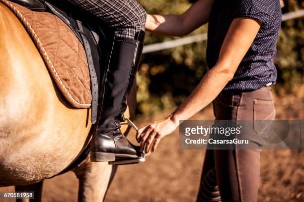 possiton of rider´s leg in stirreups - stirrup stock pictures, royalty-free photos & images