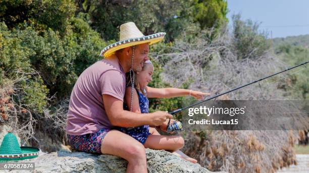 father and daughter fishing - mädchen kind stock pictures, royalty-free photos & images