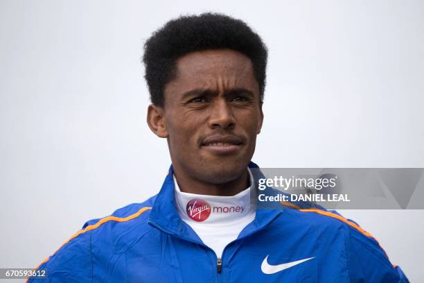 Ethiopia elite runner Feyisa Lilesa poses during a photocall for the men's marathon elite athletes outside Tower Bridge in central London on April...