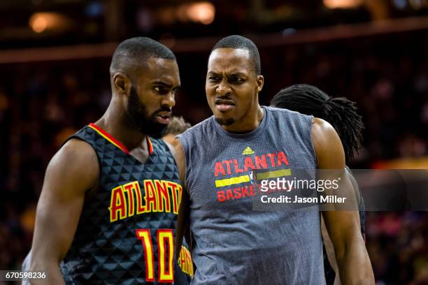 Tim Hardaway Jr. #10 and Dwight Howard of the Atlanta Hawks celebrate during the second half against the Cleveland Cavaliers at Quicken Loans Arena...
