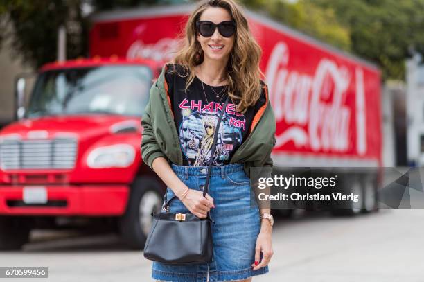 Model and fashion blogger Alexandra Lapp wearing a T-Shirt from ECNTRC with a Karl Lagerfeld look-a-like of Eddie the Head monster of the band Iron...