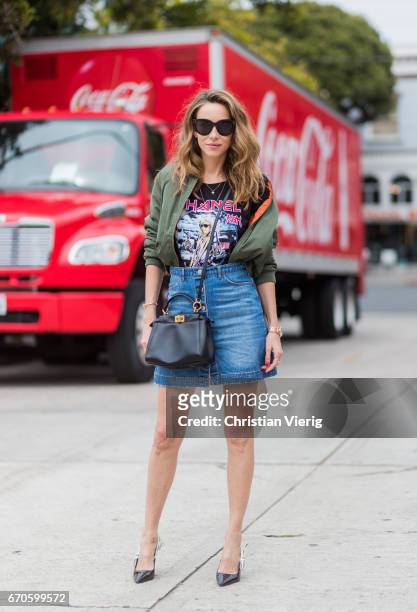 Model and fashion blogger Alexandra Lapp wearing a T-Shirt from ECNTRC with a Karl Lagerfeld look-a-like of Eddie the Head monster of the band Iron...