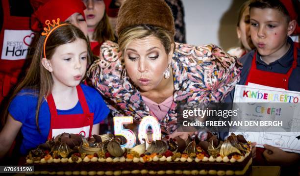 Dutch Queen Maxima attents the opening of the fiftieth Resto VanHarte in Lelystad on April 20 where children can come together to cook and learn...