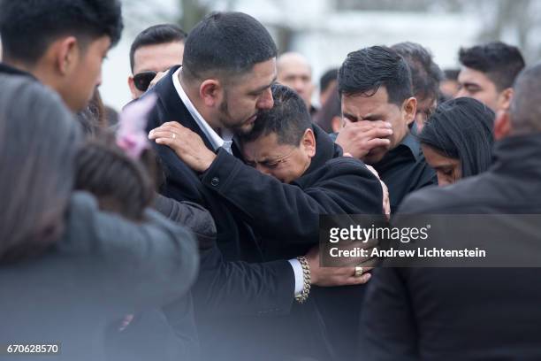 Family and friends say goodbye to Justin Llivicura at his burial in a cemetery on April 19, 2017 in Coram, Long Island, New York. Justin, a...