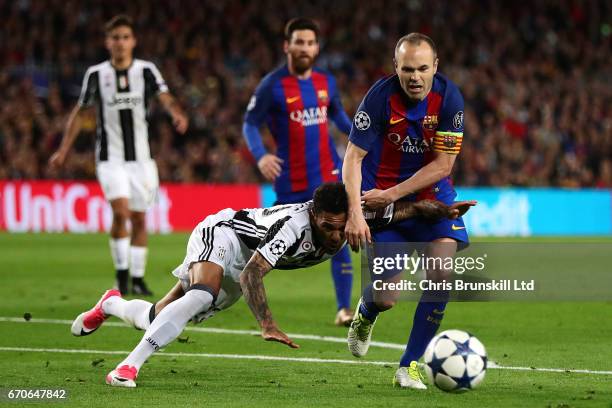 Dani Alves of Juventus tangles with Andres Iniesta of FC Barcelona during the UEFA Champions League Quarter Final second leg match between FC...