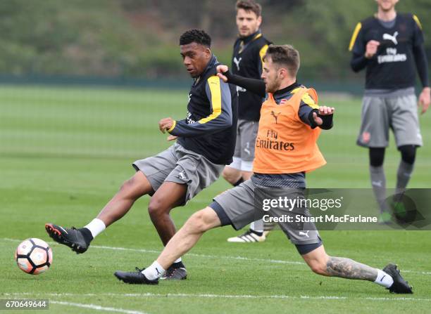 Alex Iwobi and Aaron Ramsey of Arsenal during a training session at London Colney on April 20, 2017 in St Albans, England.