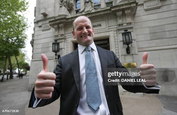Douglas Carswell, former member of the anti-EU UK Independence Party and now independent MP gives a thumbs up as he leaves Millbank tower in central...