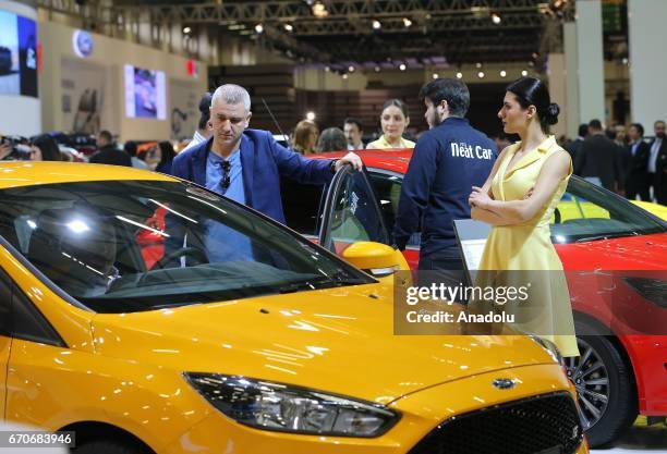 Man inspects Ford Focus during the Istanbul Autoshow 2017 at the TUYAP Fair and Convention Center in Istanbul, Turkey on April 20, 2017.