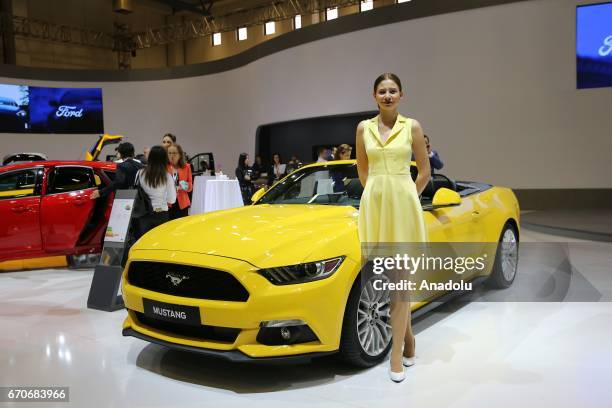 Woman stands near Mustang 2.3 Ecoboost during the Istanbul Autoshow 2017 at the TUYAP Fair and Convention Center in Istanbul, Turkey on April 20,...